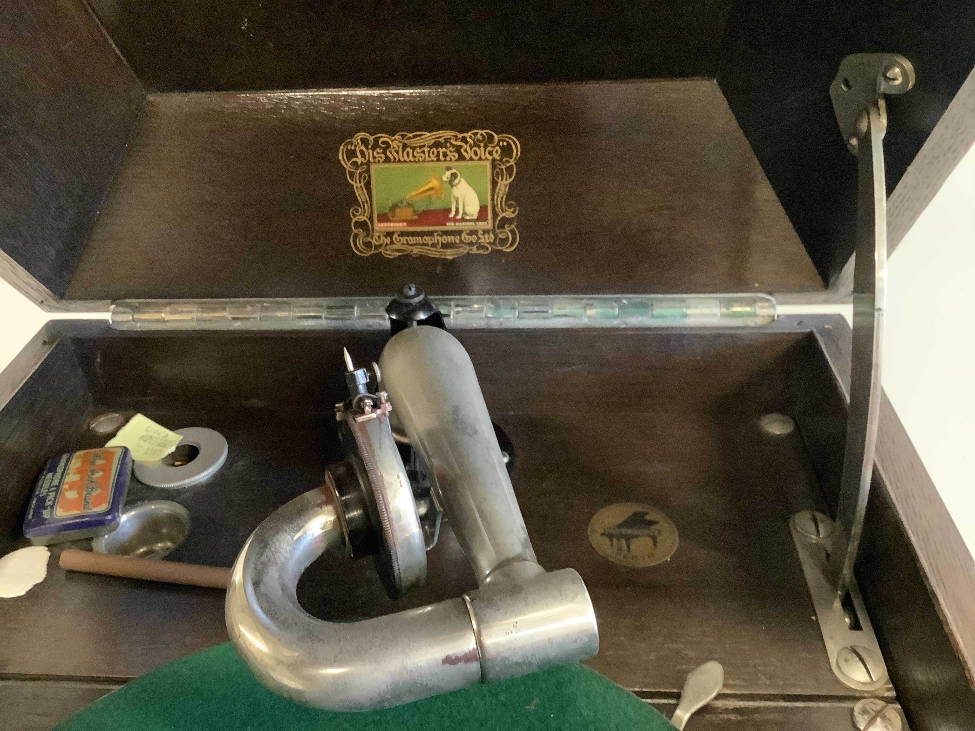 An HMV oak cased table-top gramophone on associated stand together with a collection of 78rpm records. Condition - fair